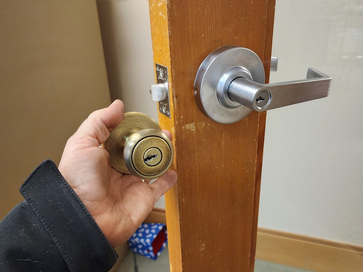 Locksmith cutting a replacement motorcycle key on a mobile workbench